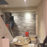 Stone wall bottom of stairs EQHI